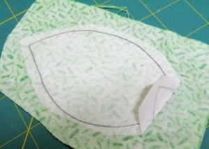 Pull a bit of paper backing off before cutting out leaf shape