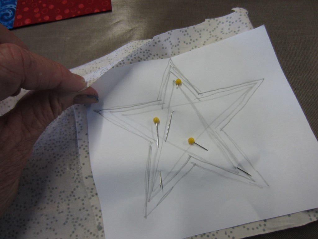 Pinning the star pattern to fabric