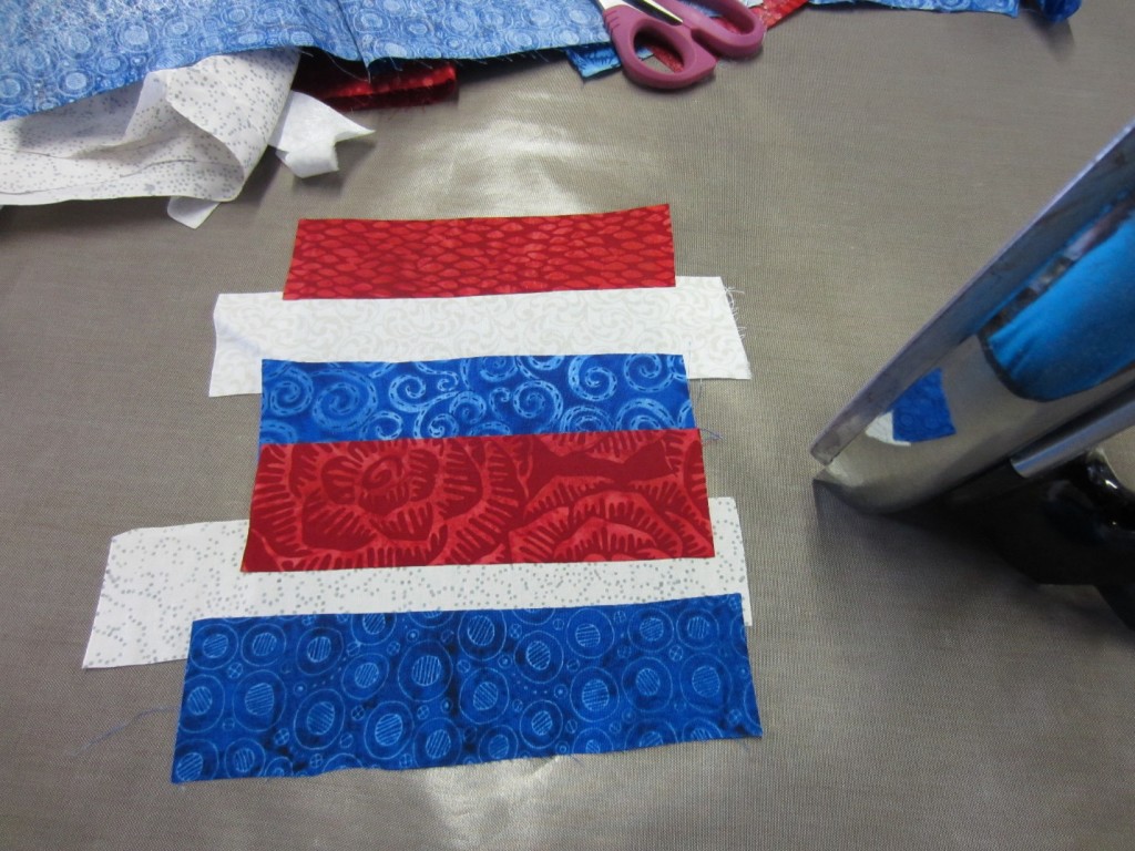 Fabric strips used for a summer flag craft project